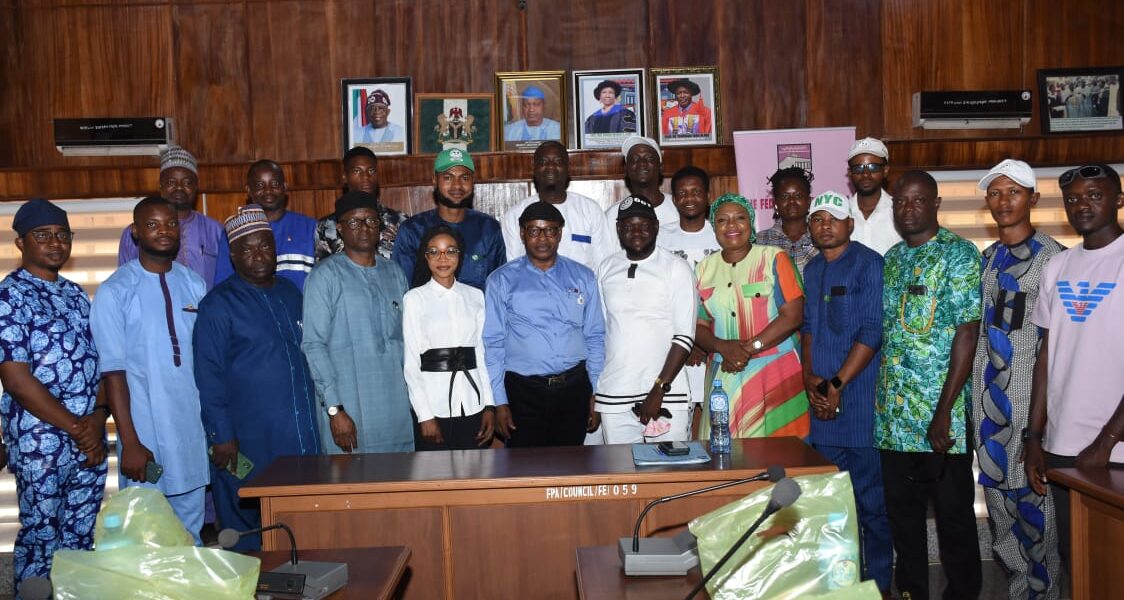 Some management staff in a group photograph with the NYC members