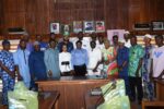 Some management staff in a group photograph with the NYC members